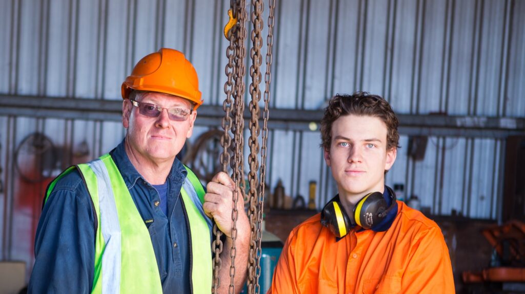 two tradesmen looking at camera|Dean Spanner|Dean Spanner|Dean Spanner